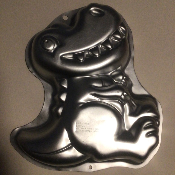 Wilton 🦖 Dinosaur Character Cake Pan with Dinosaur Themed Party Favours - Picture 2 of 9